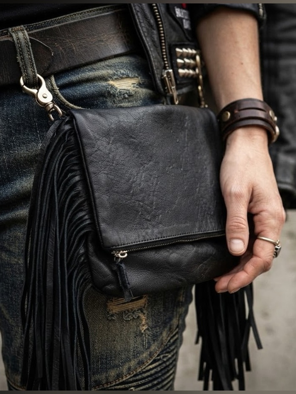 Rock your next festival, concert, or ride with this black fringe hip clip purse!